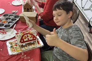 Showing off a gingerbread house creation 2025